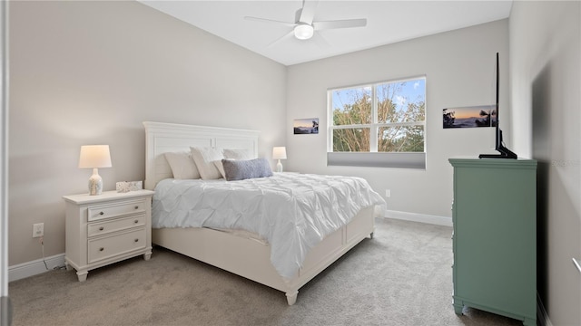 bedroom featuring light carpet and ceiling fan