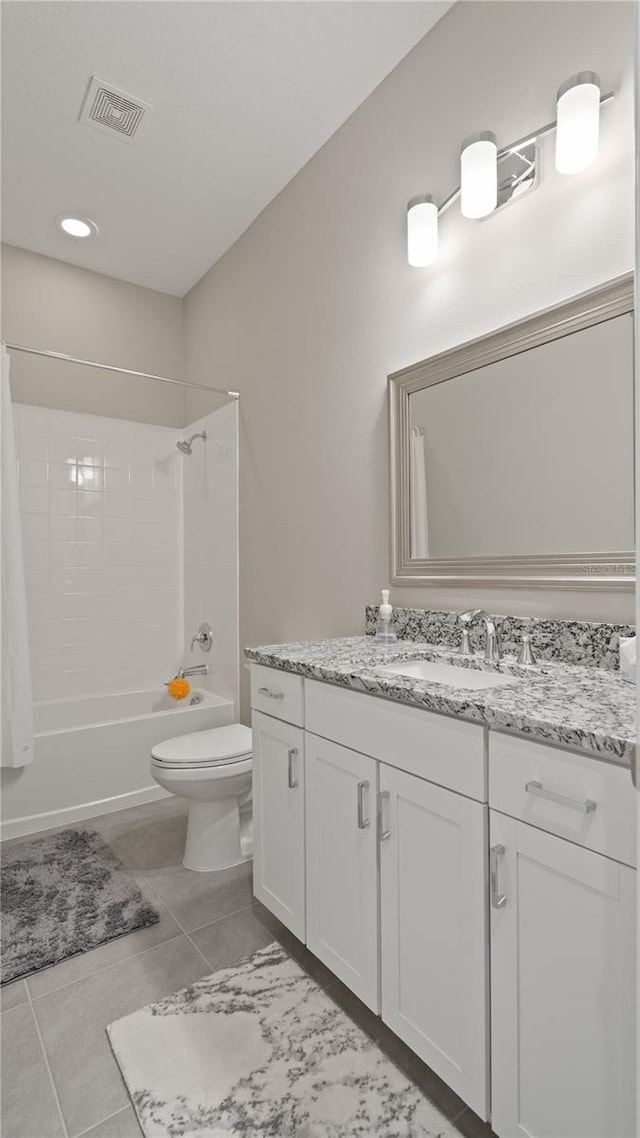 full bathroom with tile patterned flooring, vanity,  shower combination, and toilet