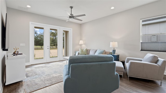 living room with hardwood / wood-style floors, french doors, and ceiling fan