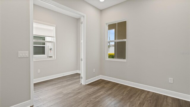 empty room featuring dark hardwood / wood-style floors