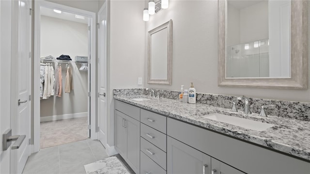 bathroom with tile patterned flooring and vanity