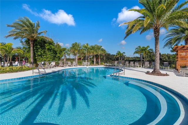 view of swimming pool with a patio