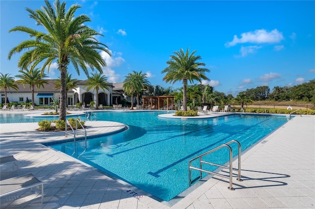 view of swimming pool with a patio