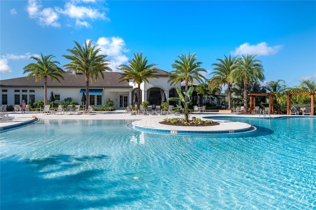 view of swimming pool with a pergola