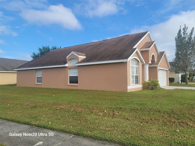 view of property exterior with a yard