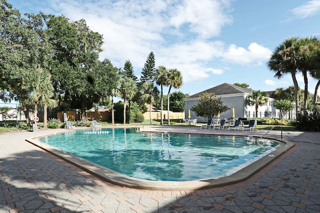 view of swimming pool with a patio area