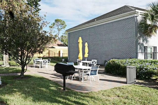 view of patio / terrace featuring fence