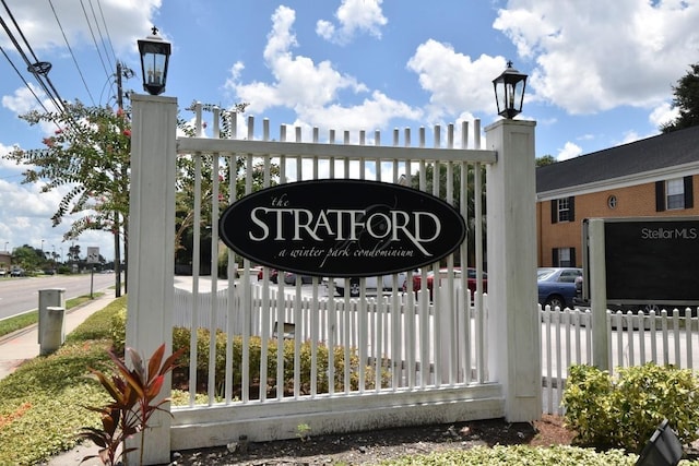 community sign with fence