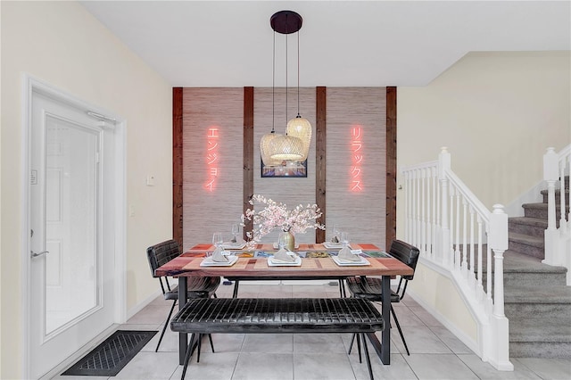 dining area with light tile patterned floors