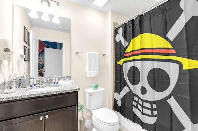 bathroom featuring vanity, toilet, and a shower with shower curtain