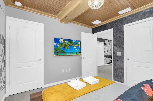 carpeted bedroom featuring beamed ceiling and wooden ceiling