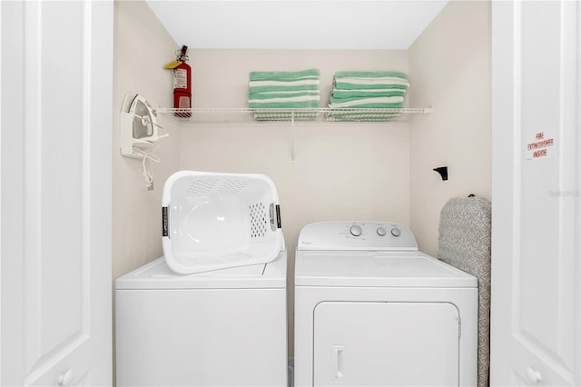 washroom featuring independent washer and dryer