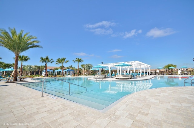 view of swimming pool featuring a patio area