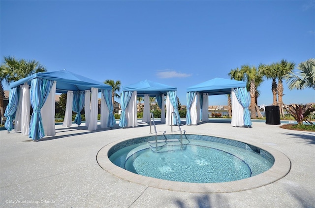 view of swimming pool with a gazebo and a patio area