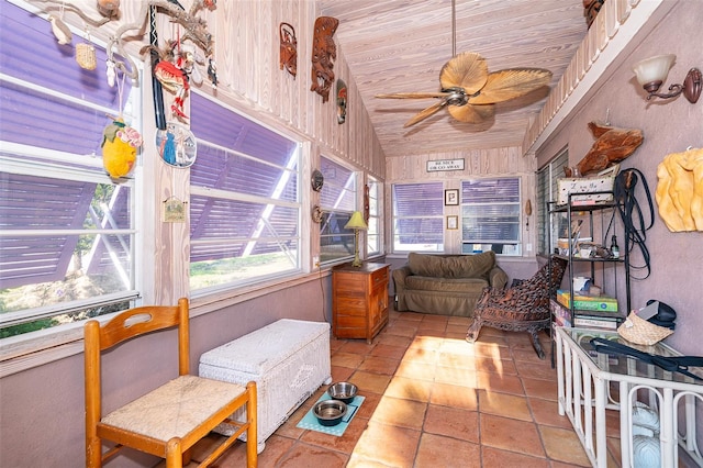 sunroom with wood ceiling, lofted ceiling, and ceiling fan