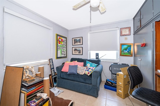 living room with light tile patterned flooring and ceiling fan