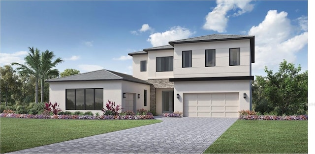 view of front of home featuring a garage and a front yard