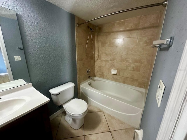 full bathroom featuring a textured ceiling, tiled shower / bath combo, tile patterned floors, vanity, and toilet