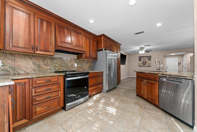 kitchen with ceiling fan, light tile patterned flooring, stainless steel appliances, and sink