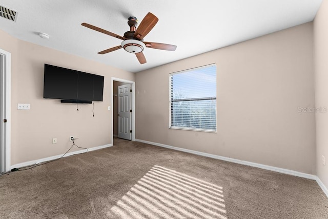 interior space with ceiling fan and carpet floors