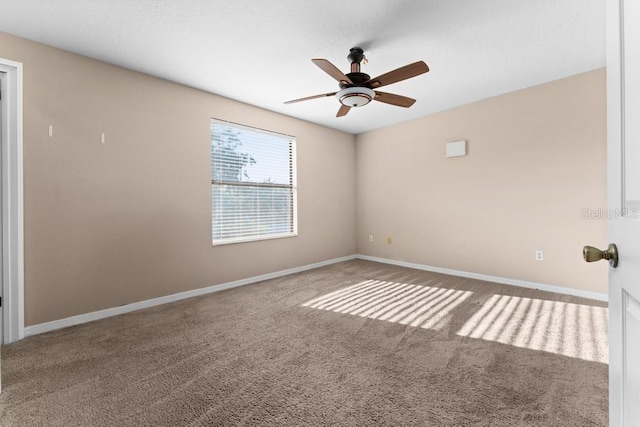 empty room featuring carpet and ceiling fan