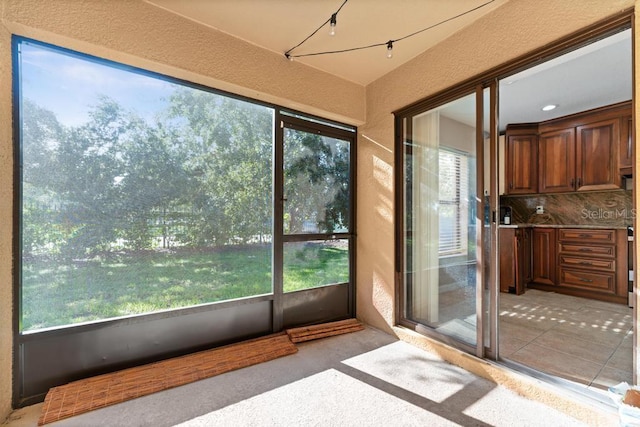 view of unfurnished sunroom