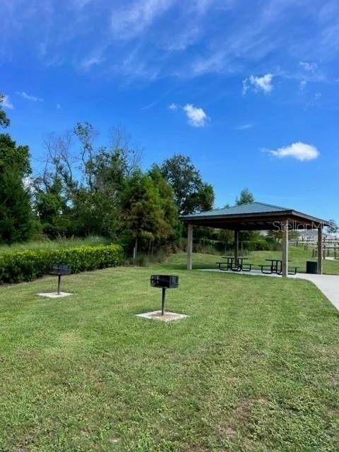 view of home's community featuring a gazebo and a yard