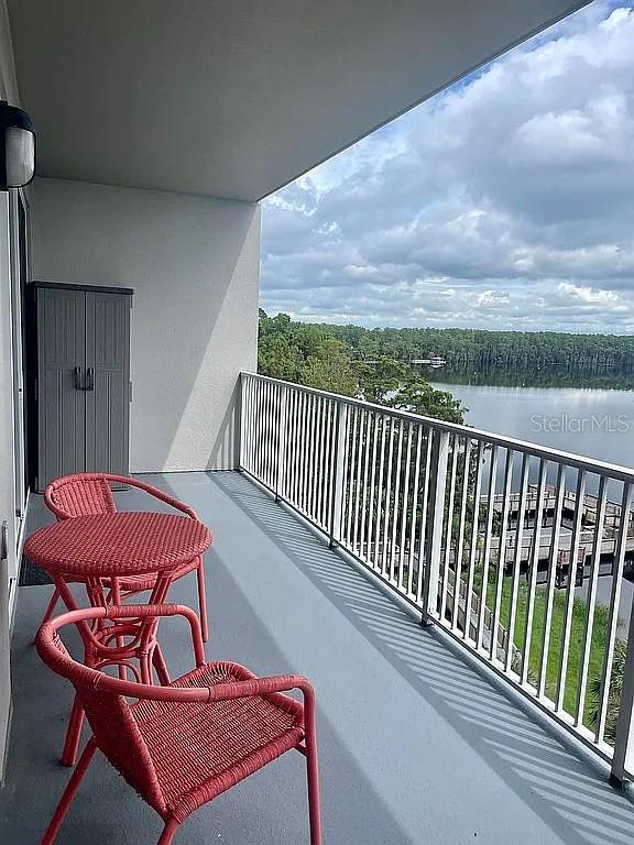 balcony featuring a water view