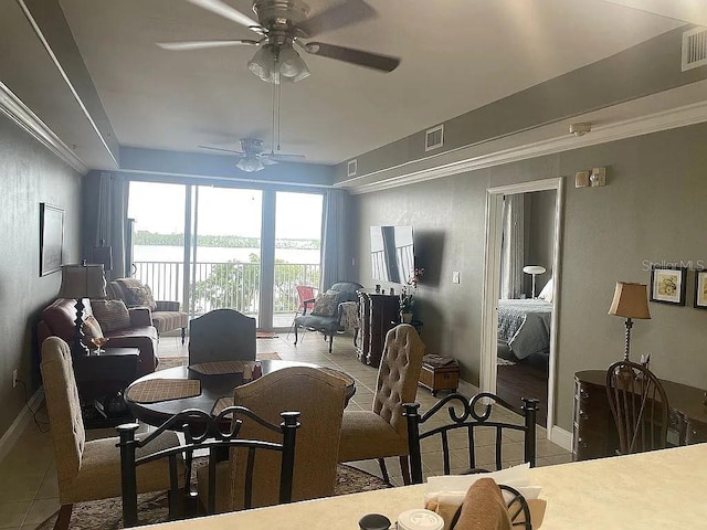 tiled dining room with ceiling fan