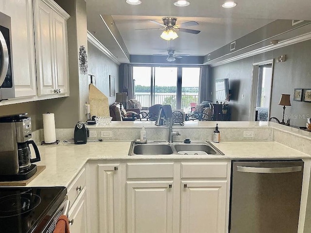 kitchen with stainless steel dishwasher, sink, ceiling fan, and white cabinets