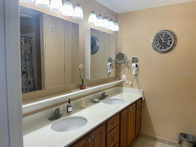 bathroom with tile patterned flooring and vanity