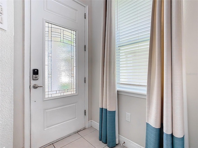 doorway featuring light tile patterned floors