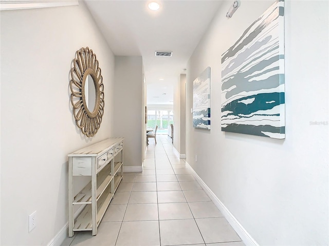 hall with light tile patterned flooring