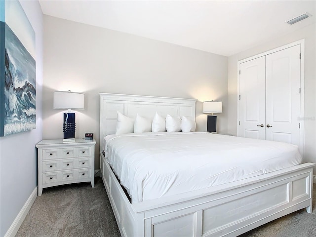 carpeted bedroom featuring a closet