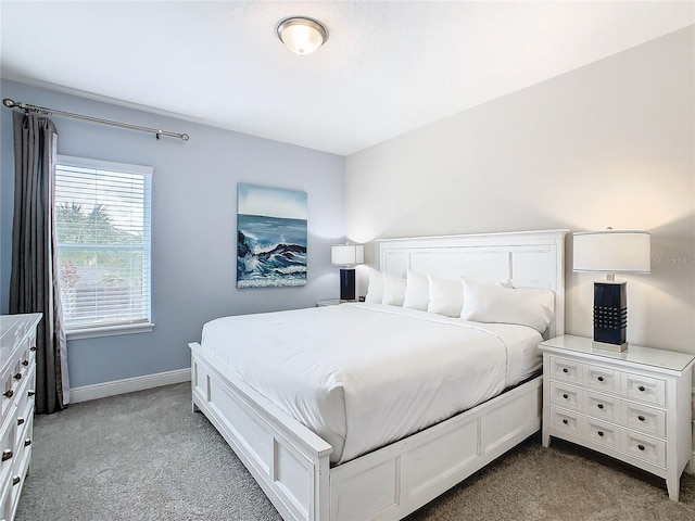 bedroom with light colored carpet