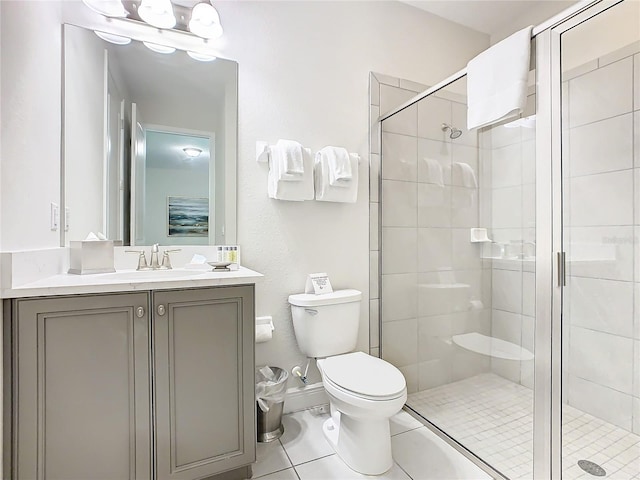 bathroom with walk in shower, tile patterned flooring, vanity, and toilet