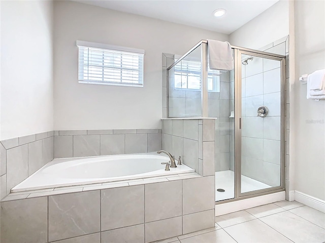 bathroom featuring tile patterned flooring and plus walk in shower