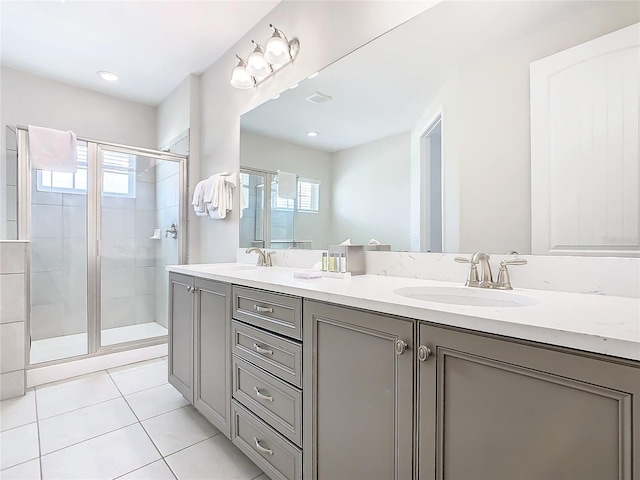 bathroom with vanity, tile patterned floors, and a shower with shower door