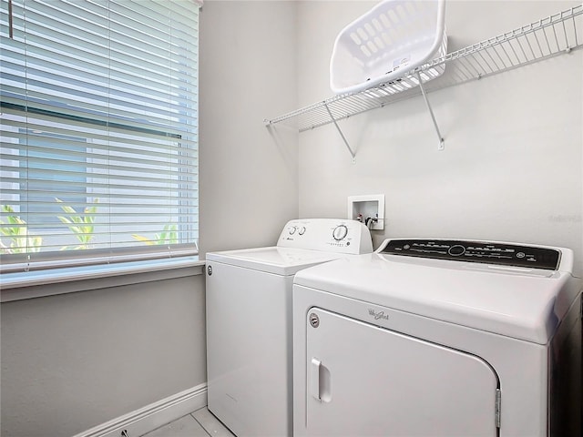 clothes washing area with washer and dryer