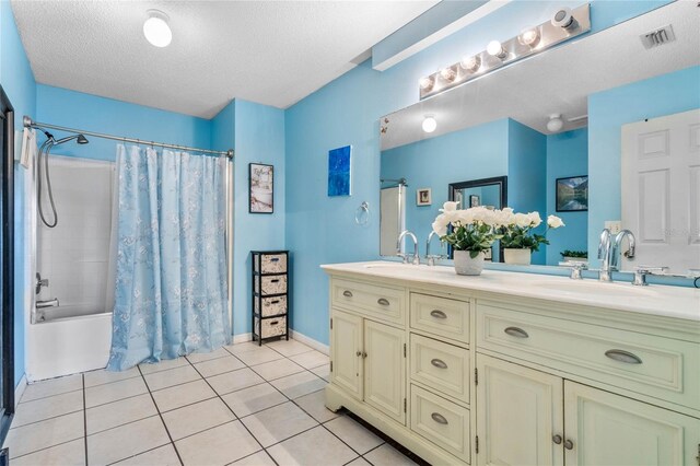 bathroom featuring shower / tub combo with curtain, a textured ceiling, tile patterned flooring, and vanity