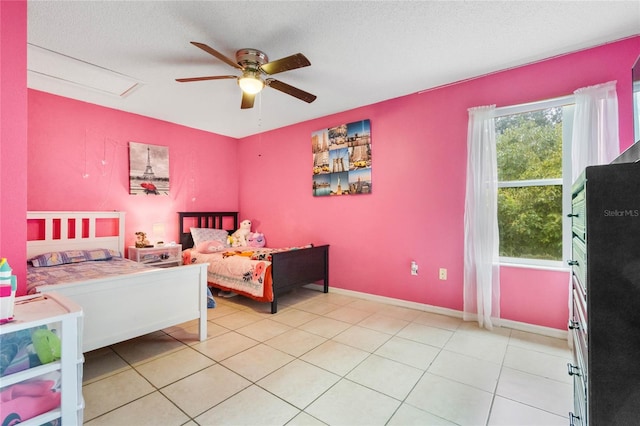 bedroom featuring light tile patterned flooring, a textured ceiling, and ceiling fan