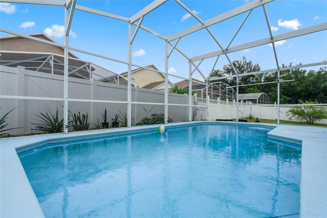 view of pool with a lanai