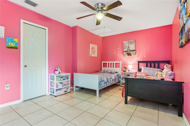 tiled bedroom with a closet and ceiling fan