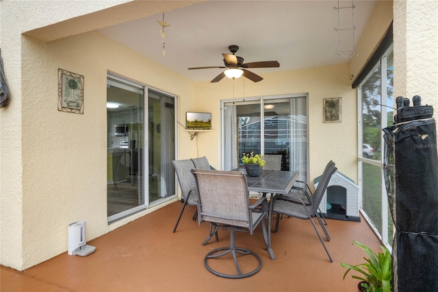 view of patio featuring ceiling fan