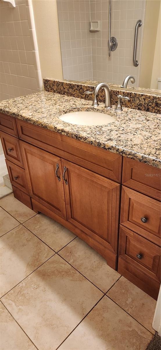 bathroom featuring vanity and tile patterned floors