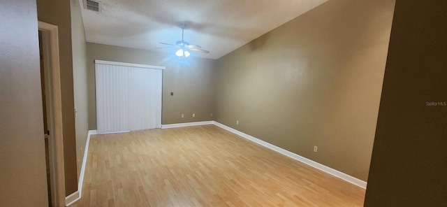 unfurnished room featuring light hardwood / wood-style floors, a textured ceiling, and ceiling fan