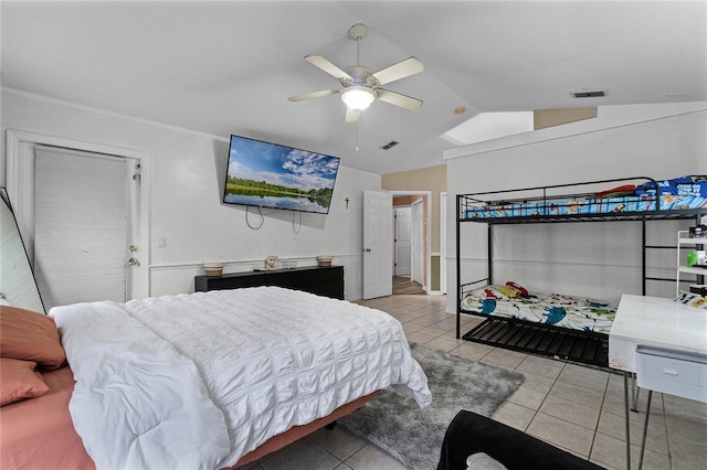 tiled bedroom featuring ceiling fan and vaulted ceiling