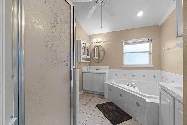 bathroom with plus walk in shower, vanity, tile patterned flooring, and ceiling fan