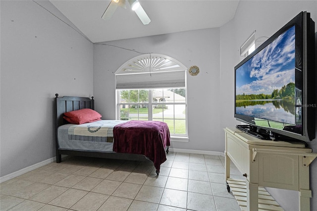 tiled bedroom featuring ceiling fan