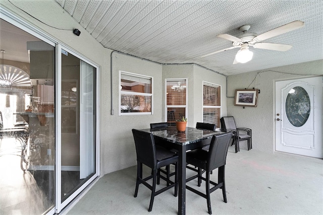 sunroom featuring ceiling fan and a wealth of natural light